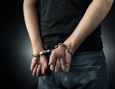 man in chains imprisonment handcuffs