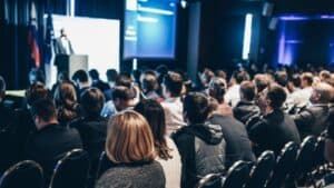 Audience attending a digital disruption conference or seminar.