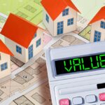 PROPERTY VALUE OF A BUILDING - WHAT DETERMINES A PROPERTY'S VALUE - Factors that affect property value - Concept with calculator and residential building model