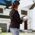Professional Real Estate Agent Conducts House Appraisal And Property Inspection.