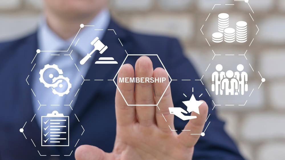 Concept of membership. Business company join us. Business person using virtual touch screen presses the word MEMBERSHIP.