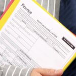 Home loan application form in hand of Agent