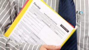 Home loan application form in hand of Agent